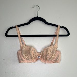 Agent Provocateur peach colored bra with baby pink bow and baby blue rose detail